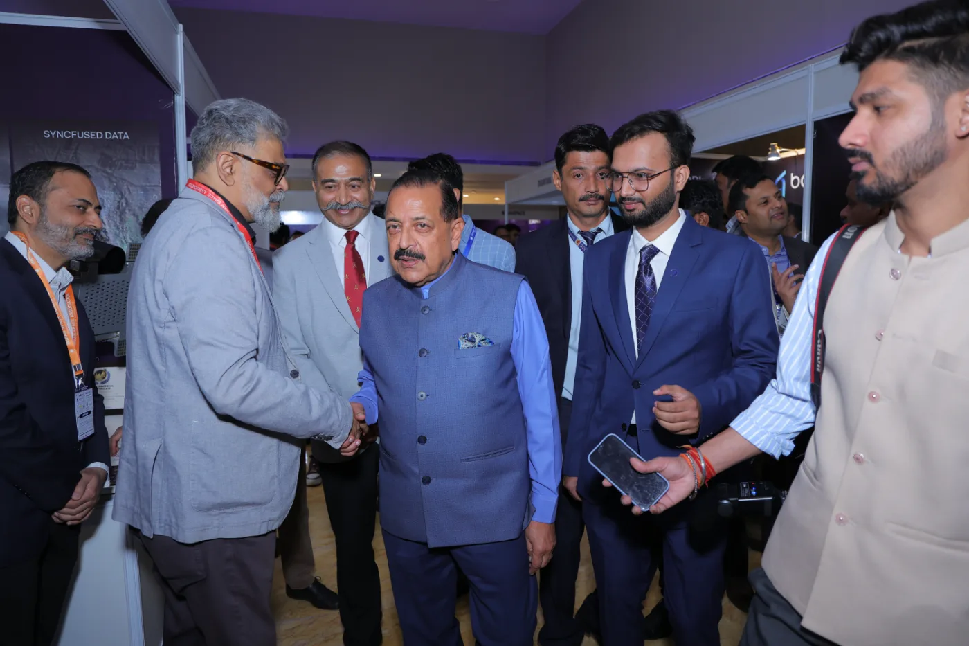 The Chief Guest shaking hands with an exhibitor on the IISC 2025 exhibition floor